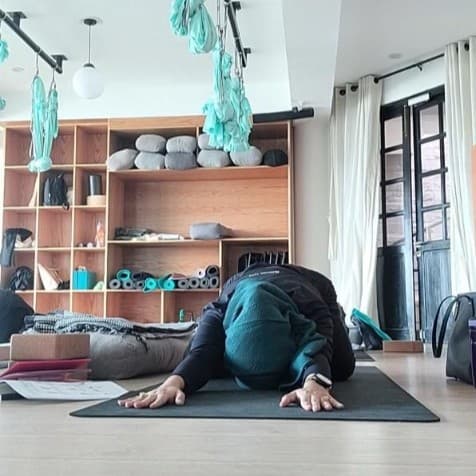 Yoga Instructor Maha in a pose